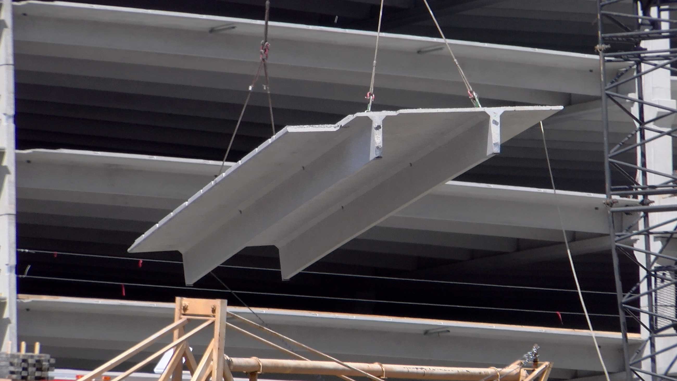 Double-Tee Lifted into Place On Site